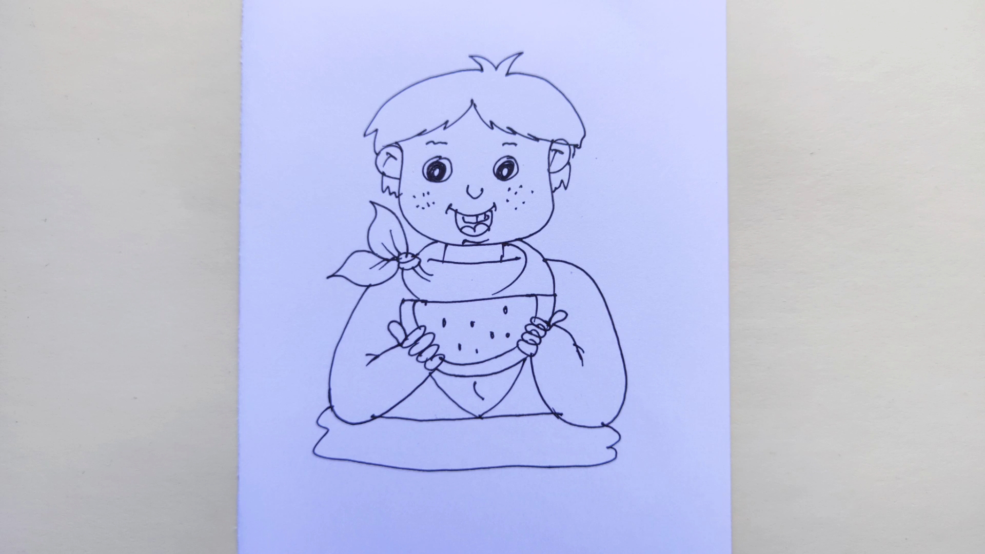 幼儿绘画画一个吃西瓜的男孩